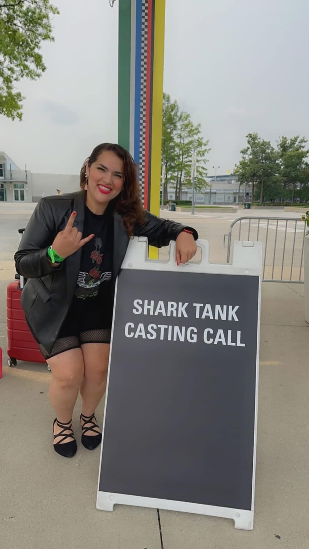 Miriam D. Rivera beside the Shark Tank casting call sign